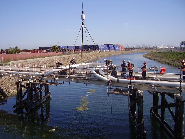 Crew working on a pipeline crossing over water